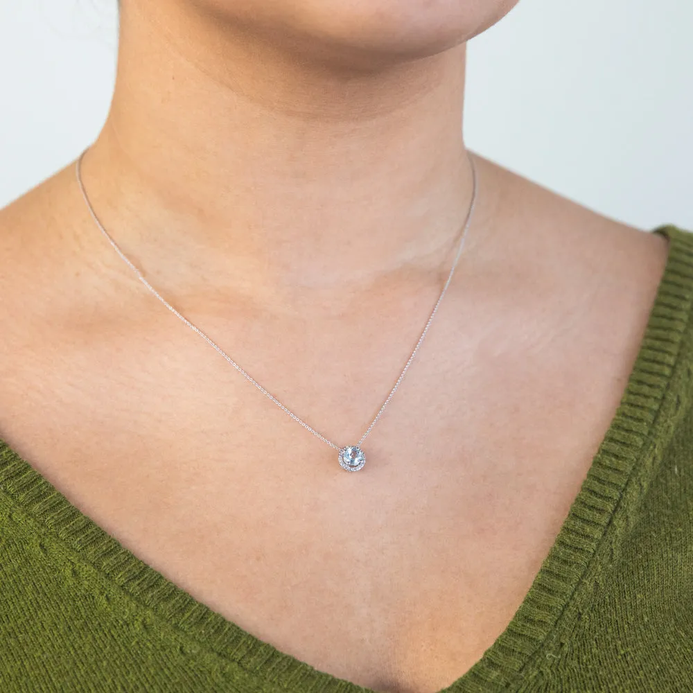 9ct White Gold 0.45ct Aquamarine and Diamond Halo Pendant on 45cm Chain
