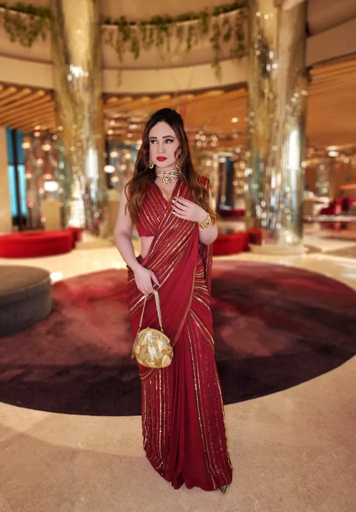 Stephanie Timmings in Red draped hand-embroidered sari with V-neck Blouse from our Caged Kaleidoscope Ethnic collection