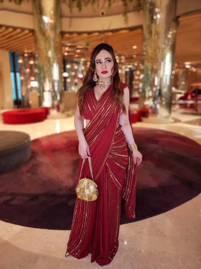 Stephanie Timmings in Red draped hand-embroidered sari with V-neck Blouse from our Caged Kaleidoscope Ethnic collection