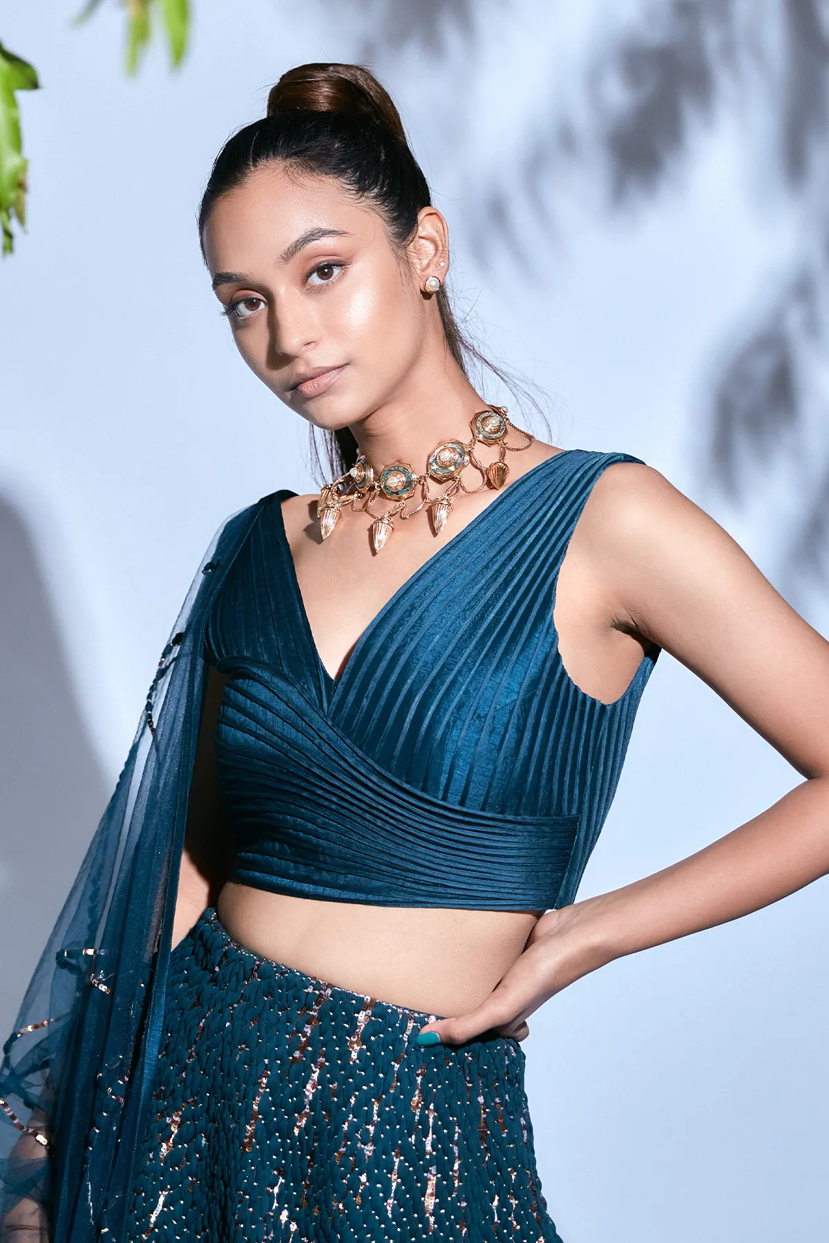 Teal Blouse paired with Teal Hand-embroidered Lehenga and Teal Hand-embroidered Dupatta