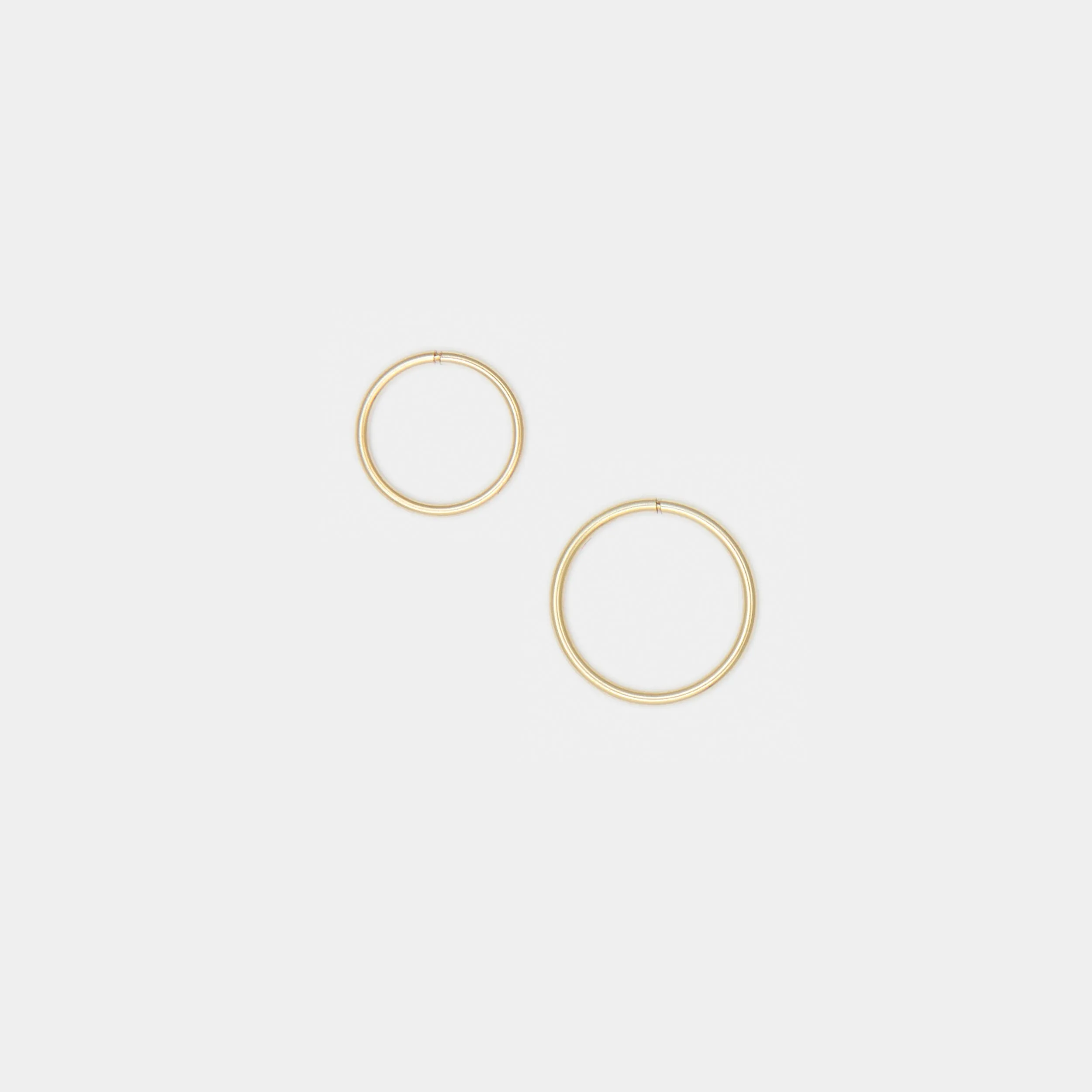 Tiny Hoops in 10k Gold